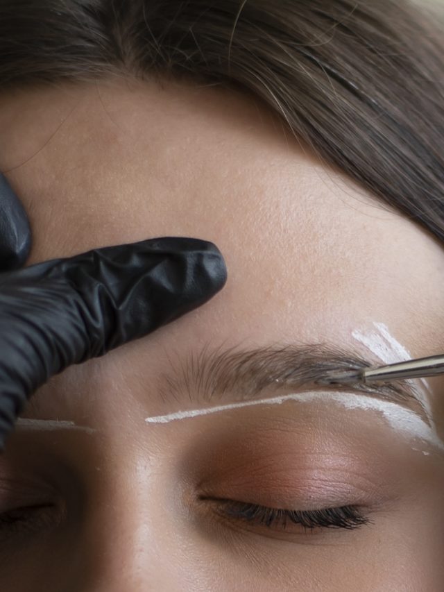 Woman during eyebrow tinting procedure, closeup view